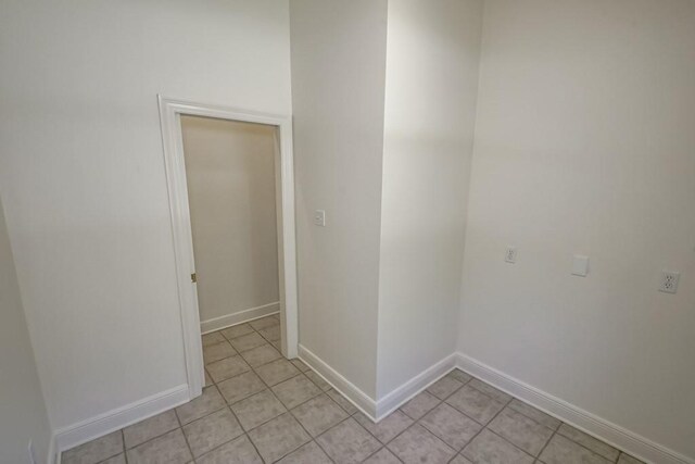 bathroom with a shower with door, toilet, and hardwood / wood-style floors