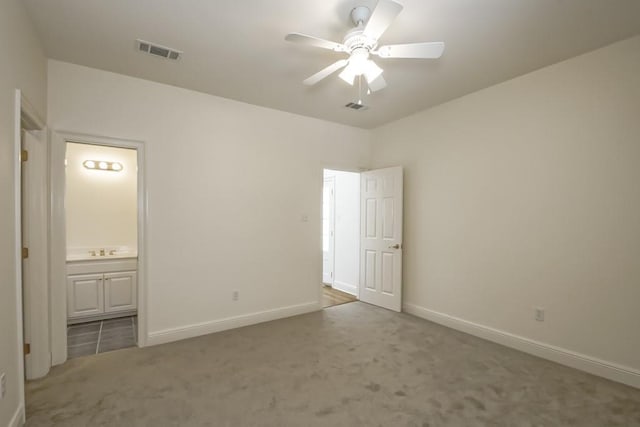 unfurnished bedroom with baseboards, visible vents, and carpet flooring
