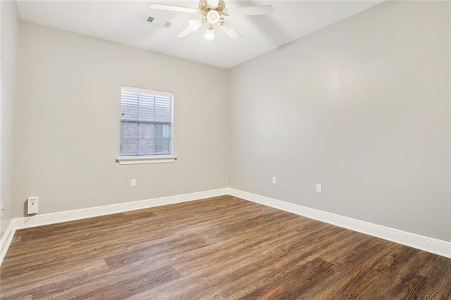 empty room with hardwood / wood-style floors and ceiling fan