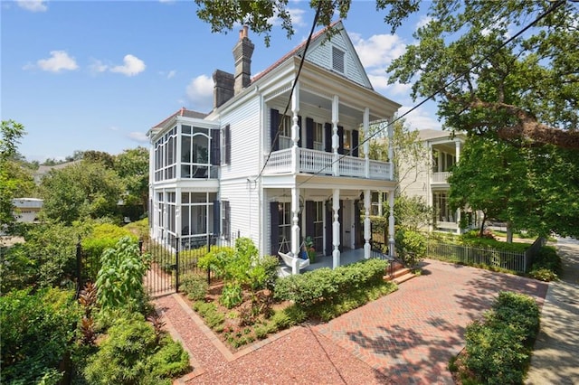 back of property featuring a balcony