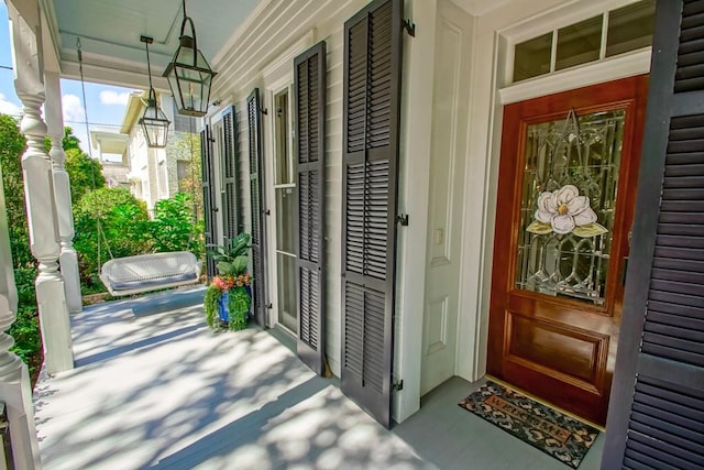 doorway to property with a porch