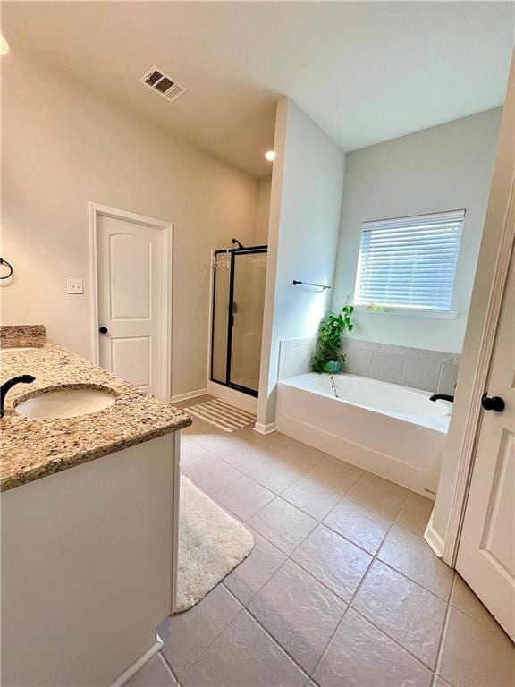 bathroom featuring vanity, separate shower and tub, and tile patterned flooring