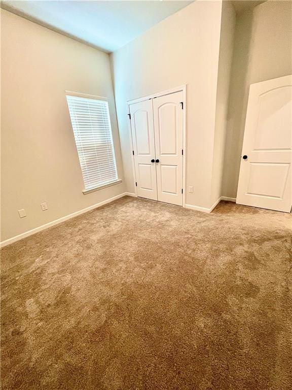 unfurnished bedroom featuring carpet flooring