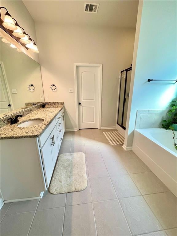 bathroom with vanity, tile patterned floors, and separate shower and tub