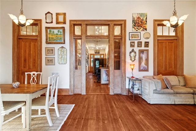 dining area featuring a notable chandelier and hardwood / wood-style floors