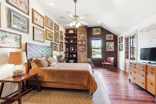 bedroom featuring dark wood-type flooring, ceiling fan, and vaulted ceiling