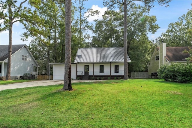 view of front facade with a front yard, a porch, and a garage