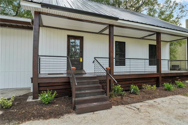 property entrance featuring covered porch