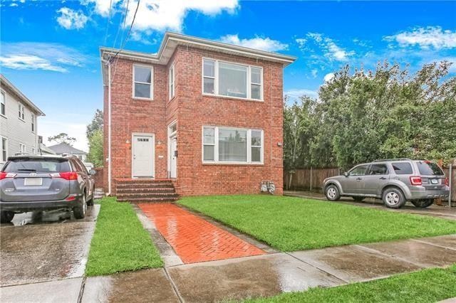 view of front of home with a front yard