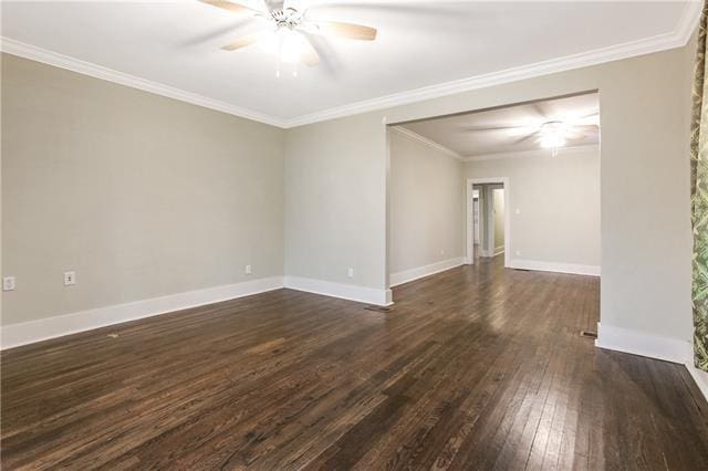 empty room featuring crown molding, dark wood-type flooring, and ceiling fan