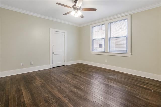 unfurnished room featuring ceiling fan, crown molding, and dark hardwood / wood-style floors