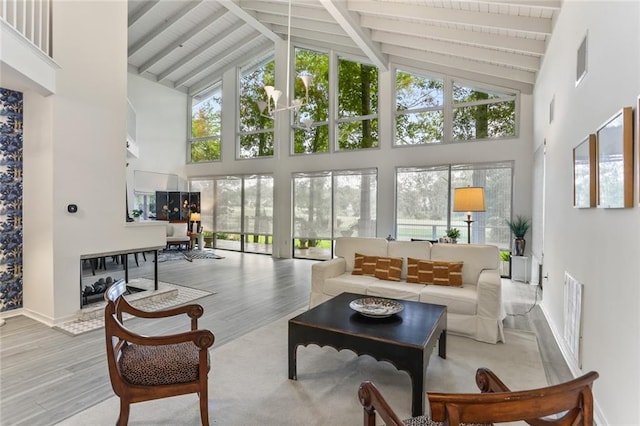 sunroom with lofted ceiling with beams