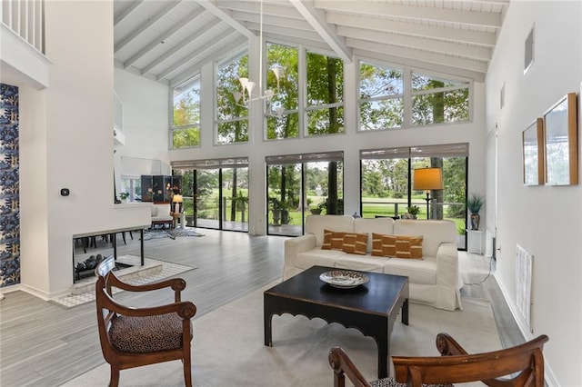 sunroom / solarium with vaulted ceiling with beams