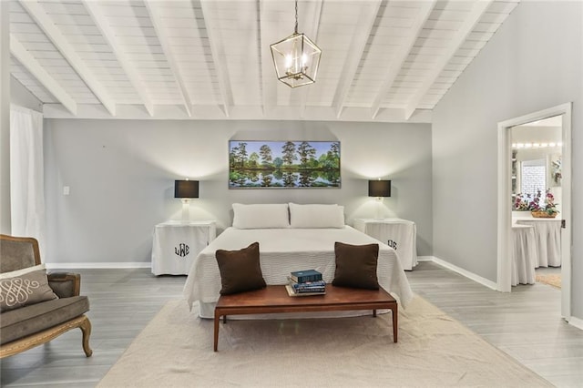 bedroom with hardwood / wood-style floors, wooden ceiling, and lofted ceiling with beams