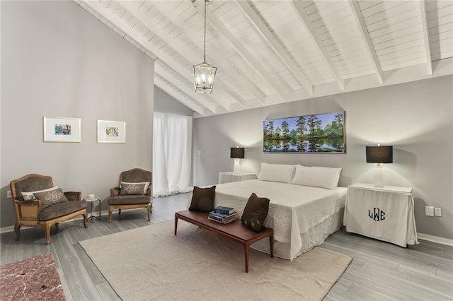 bedroom featuring high vaulted ceiling, wood-type flooring, a notable chandelier, and beam ceiling