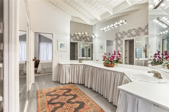 bathroom with wooden ceiling, hardwood / wood-style flooring, beam ceiling, high vaulted ceiling, and vanity