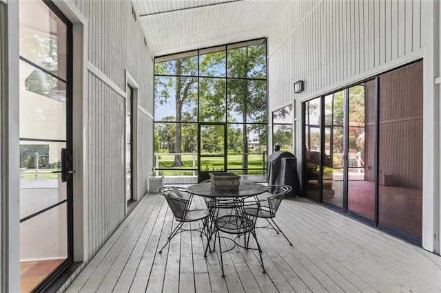 sunroom / solarium with lofted ceiling