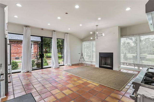 tiled living room featuring lofted ceiling and a notable chandelier