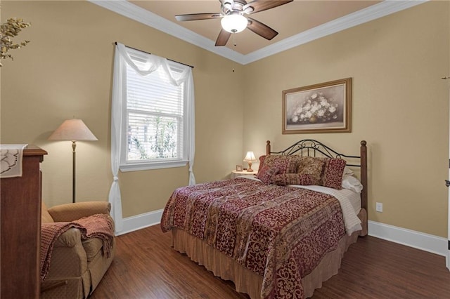 bedroom with dark hardwood / wood-style flooring, crown molding, and ceiling fan