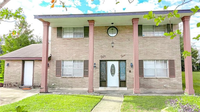 view of property featuring a front yard