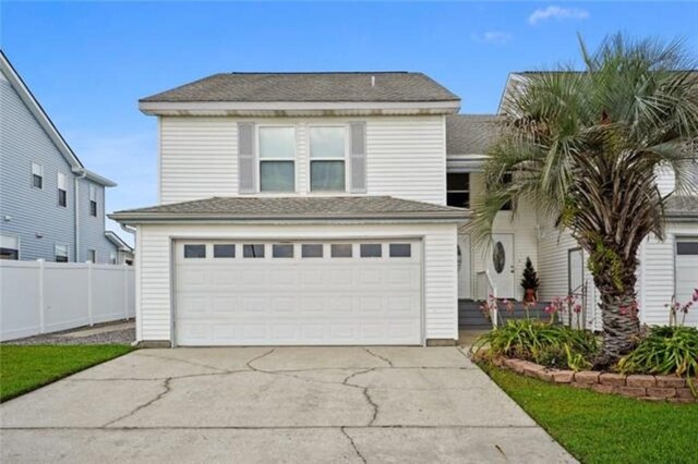 front of property featuring a garage