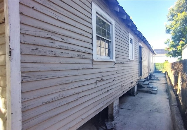 view of side of home featuring a patio area