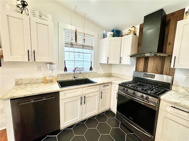 kitchen featuring a sink, white cabinetry, appliances with stainless steel finishes, wall chimney exhaust hood, and vaulted ceiling