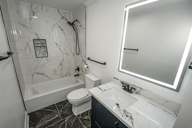 full bathroom featuring tiled shower / bath, vanity, and toilet