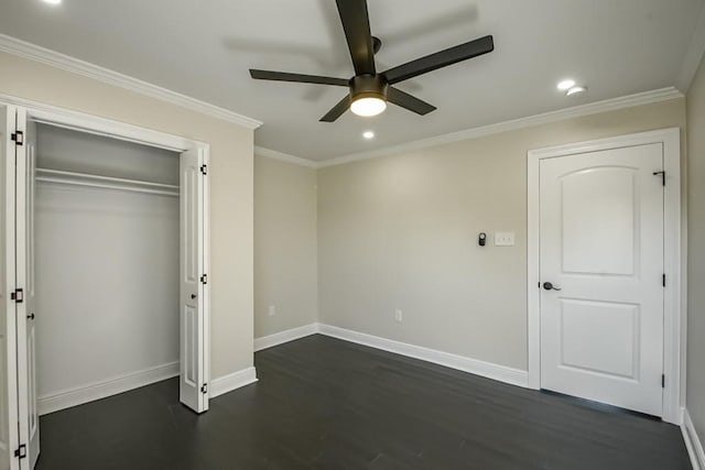 unfurnished bedroom with a closet, ceiling fan, ornamental molding, and dark hardwood / wood-style floors