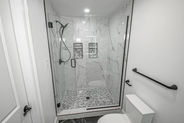 bathroom with toilet and walk in shower