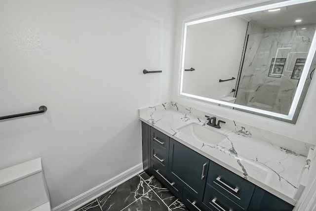 bathroom with vanity, toilet, and walk in shower