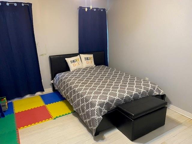 bedroom featuring hardwood / wood-style floors