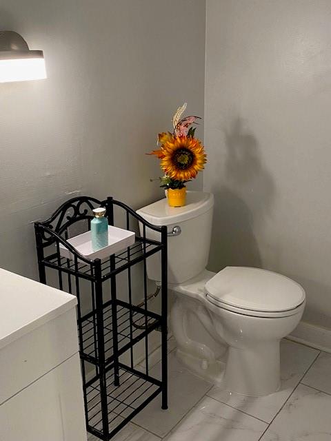 bathroom featuring vanity and toilet