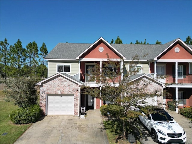 view of front facade featuring a balcony and a garage