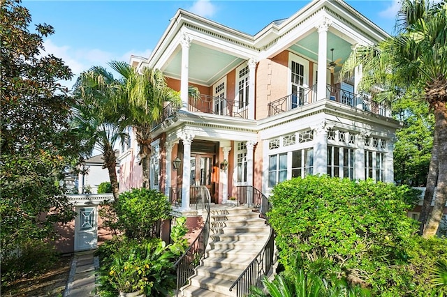 view of front of house with covered porch and a balcony