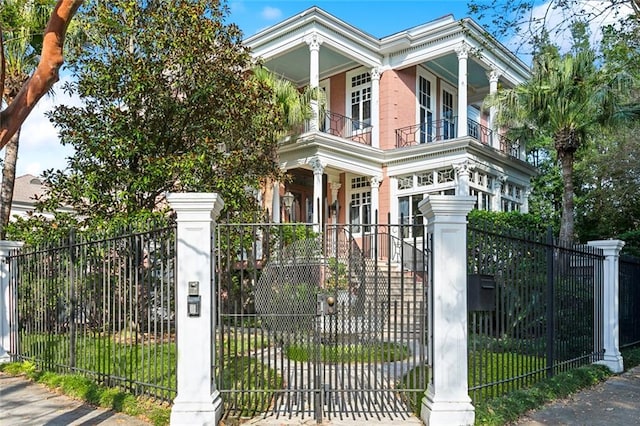 view of front facade featuring covered porch and a balcony