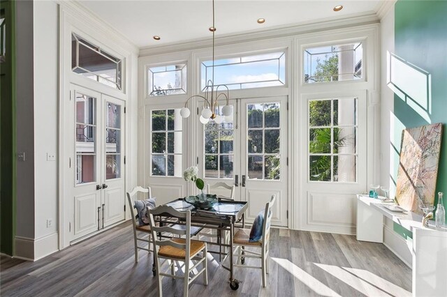 sunroom with a chandelier