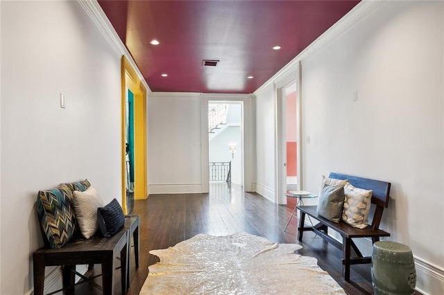 hall featuring dark hardwood / wood-style floors and crown molding