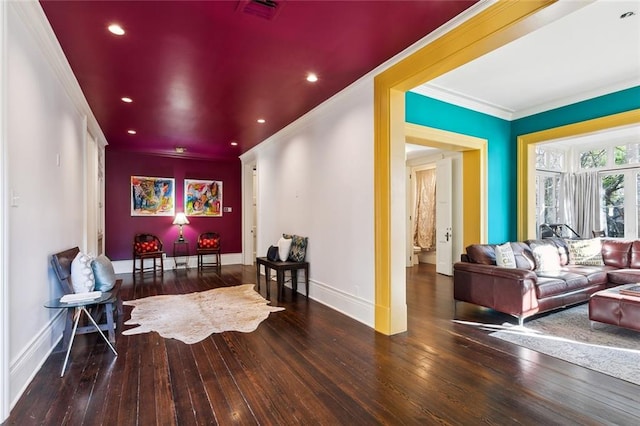 living area featuring hardwood / wood-style floors and ornamental molding