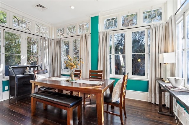 sunroom / solarium featuring a healthy amount of sunlight