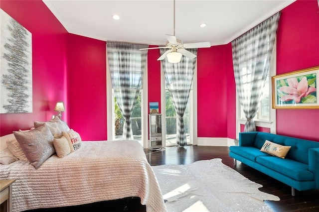 bedroom with hardwood / wood-style flooring, ceiling fan, multiple windows, and access to outside