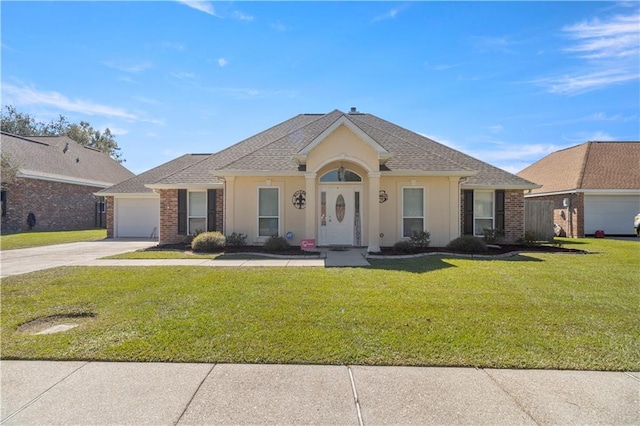 ranch-style home with a front lawn and a garage