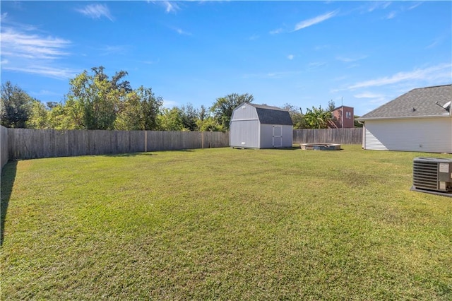 view of yard with cooling unit and a storage shed