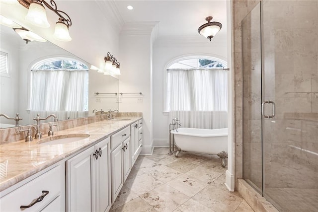 bathroom featuring vanity, ornamental molding, and shower with separate bathtub