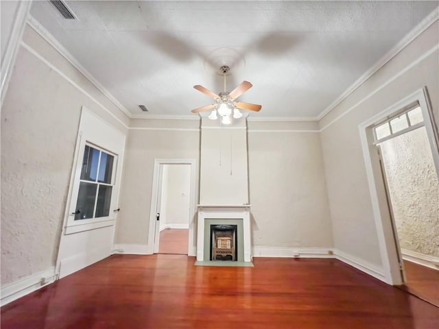 unfurnished living room with crown molding, wood-type flooring, and ceiling fan