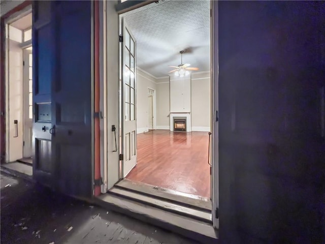 hall featuring crown molding and hardwood / wood-style flooring