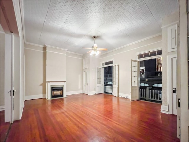 unfurnished living room featuring ceiling fan, hardwood / wood-style flooring, and ornamental molding