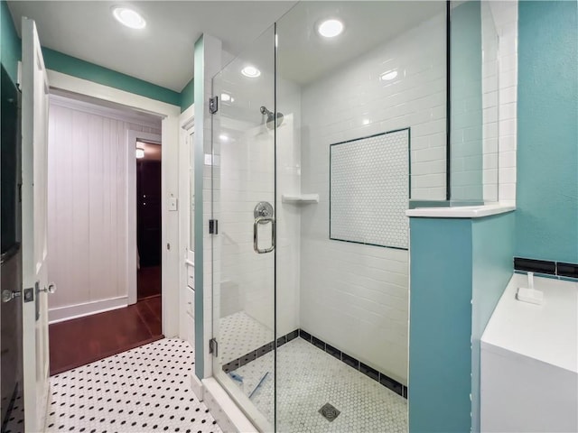 bathroom featuring a shower with shower door