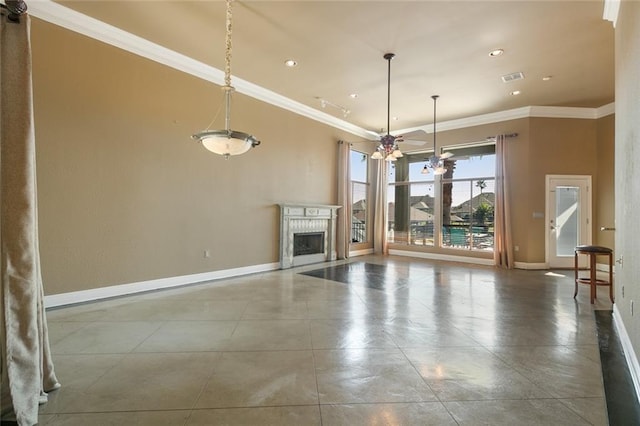 unfurnished living room featuring a premium fireplace, ceiling fan, and crown molding