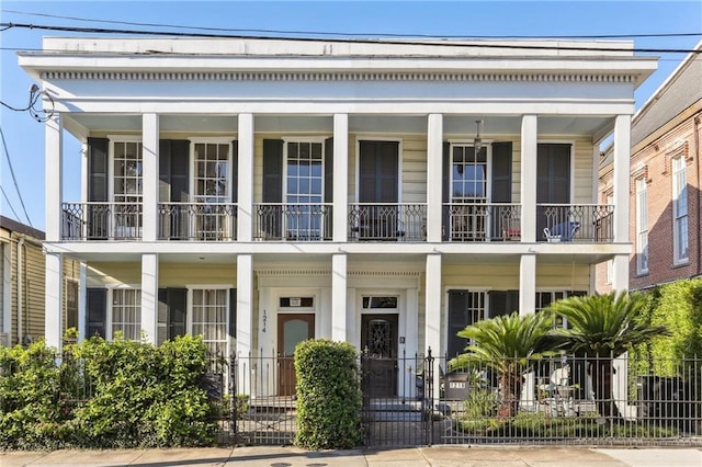 1214 Felicity St, New Orleans, LA 70130 - view of front facade with a balcony and covered porch